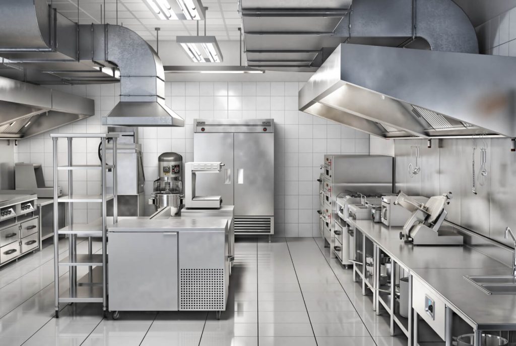 large commercial kitchen with hoods, prep area, slicer, fryer, mixer and pizza oven