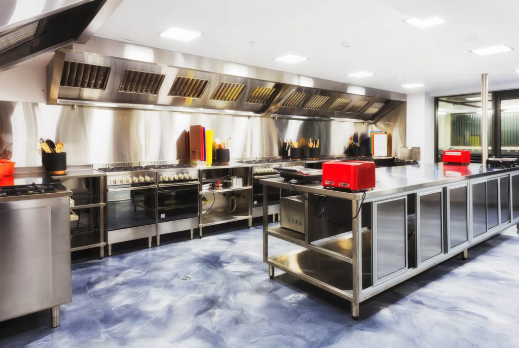 large commercial kitchen with large and small appliances