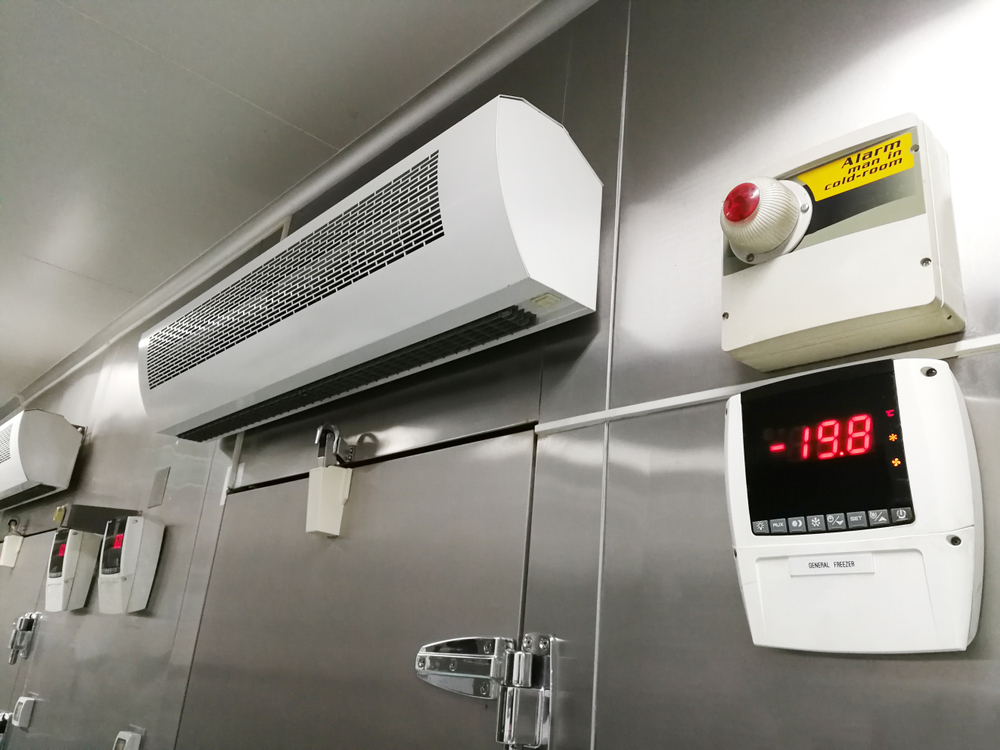 AC unit above commercial refrigeration system